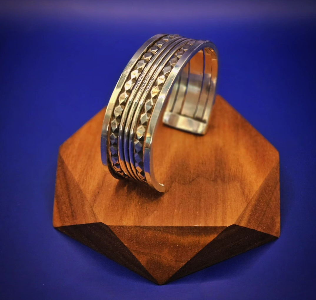 5 band sterling silver cuff made with pattern wire and an oxidized finish.