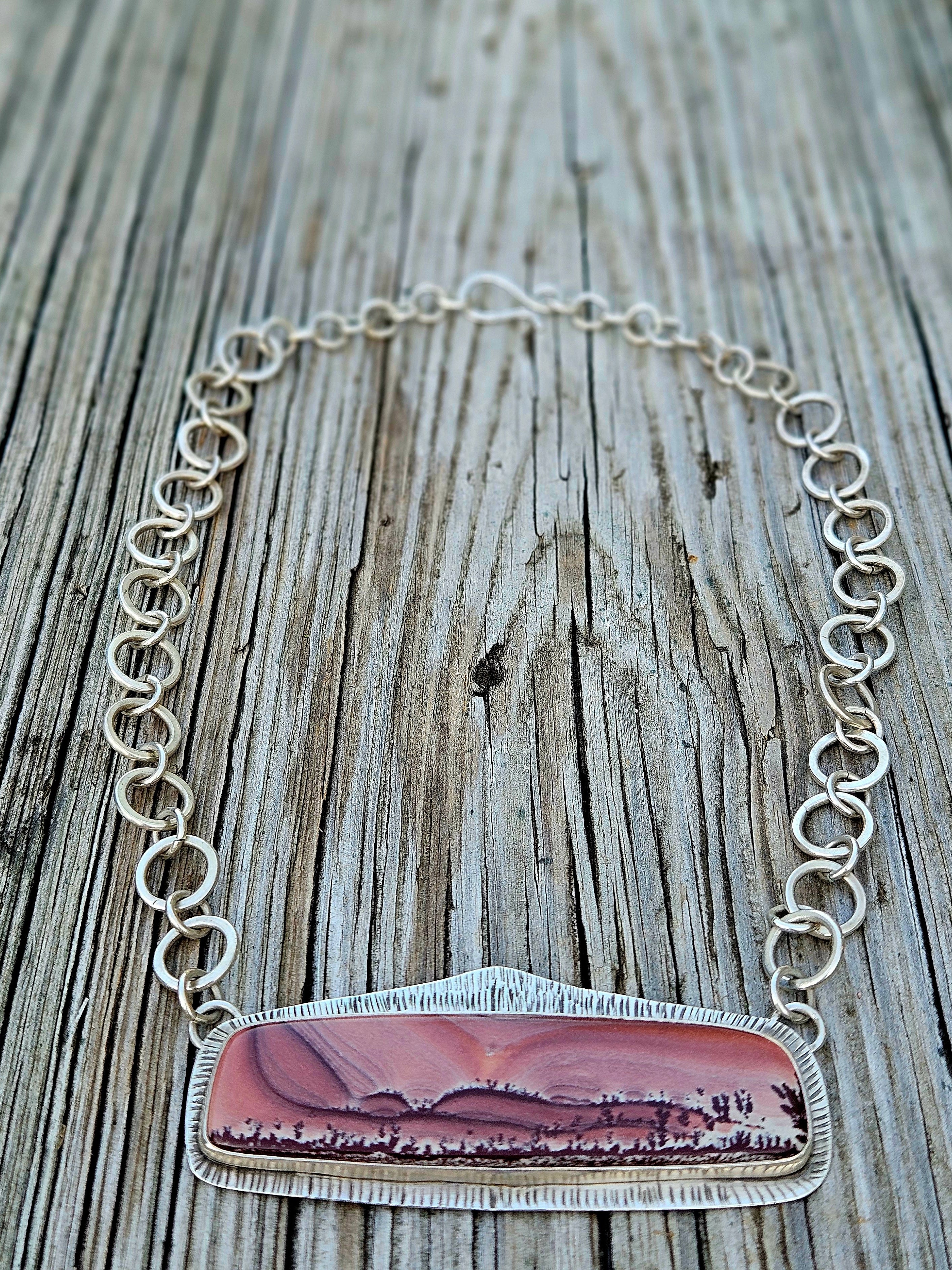 Rectangular Apache Sage Rhyolite Pendant set in sterling silver with an 16 inch handmade chain. Pink sunset desert scene