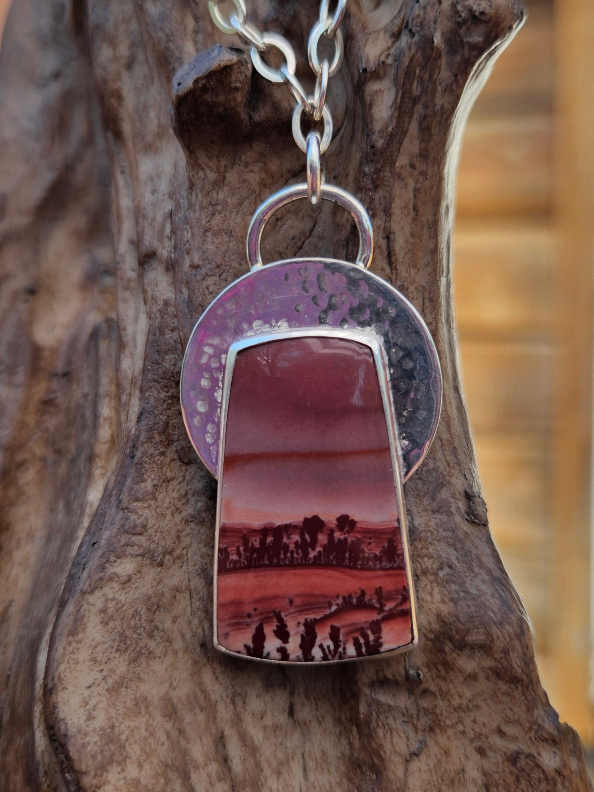 Apache Sage Rhyolite Pendant set in sterling silver with a hammered circle backplate and an 18" silver chain. 