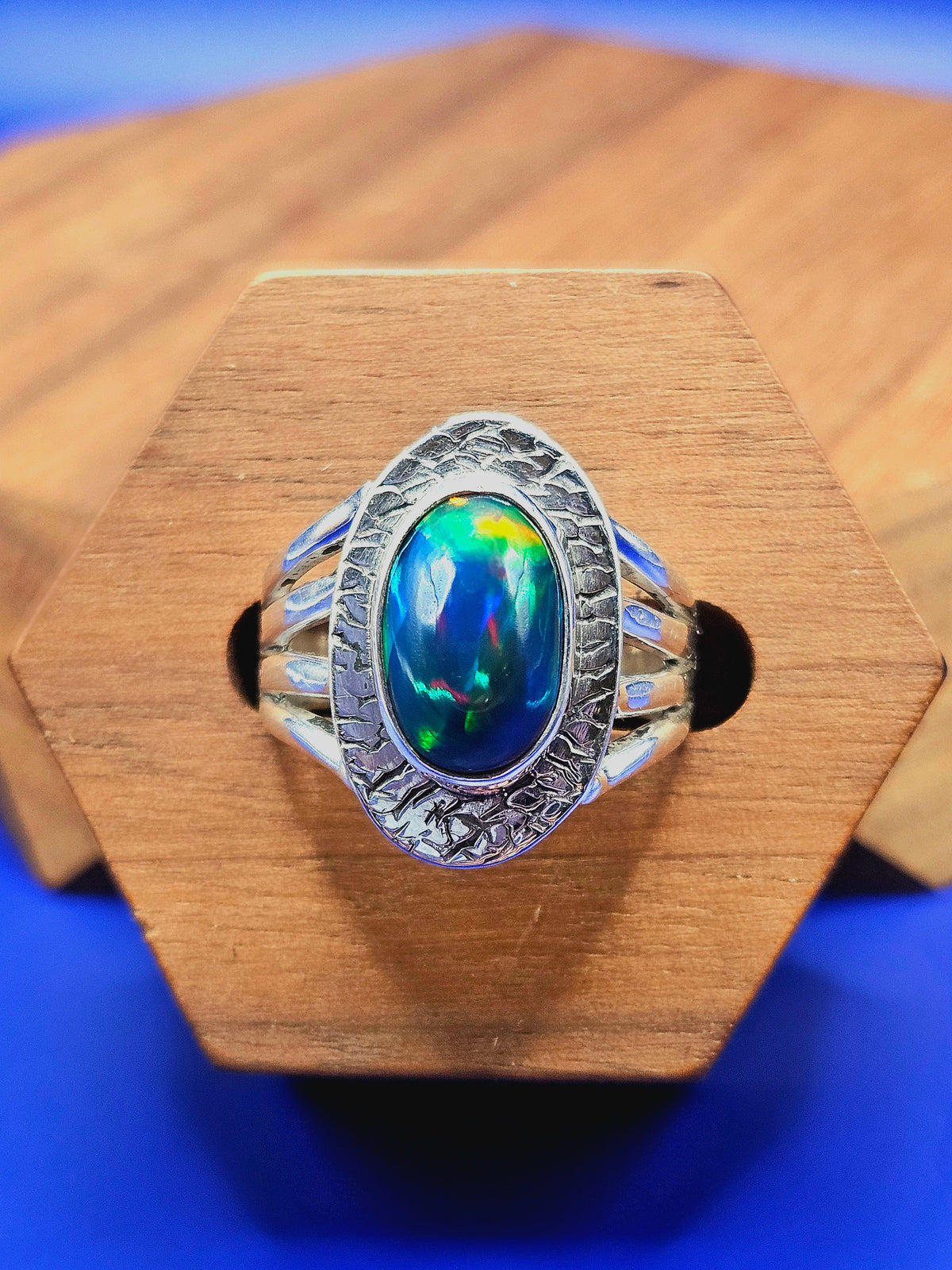  Shop our handcrafted Abyssal Fire Ring. Featuring a natural black Ethiopian opal with 3D neon green & blue fire set in a rustic