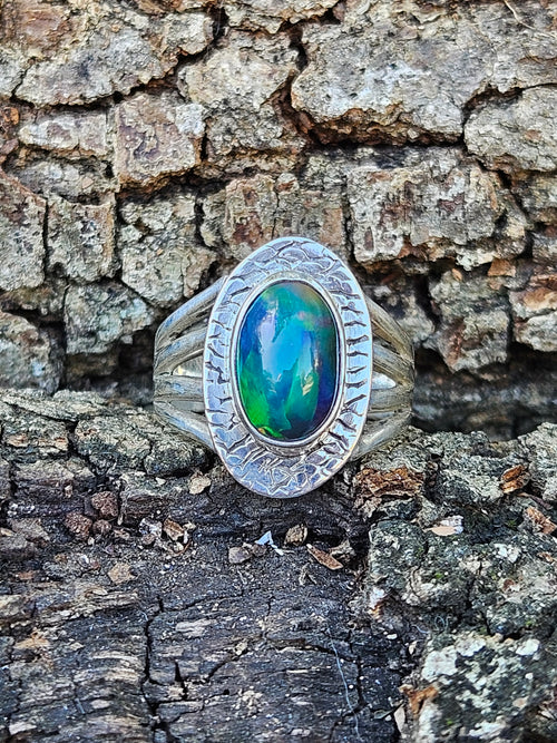  Shop our handcrafted Abyssal Fire Ring. Featuring a natural black Ethiopian opal with 3D neon green & blue fire set in a rustic