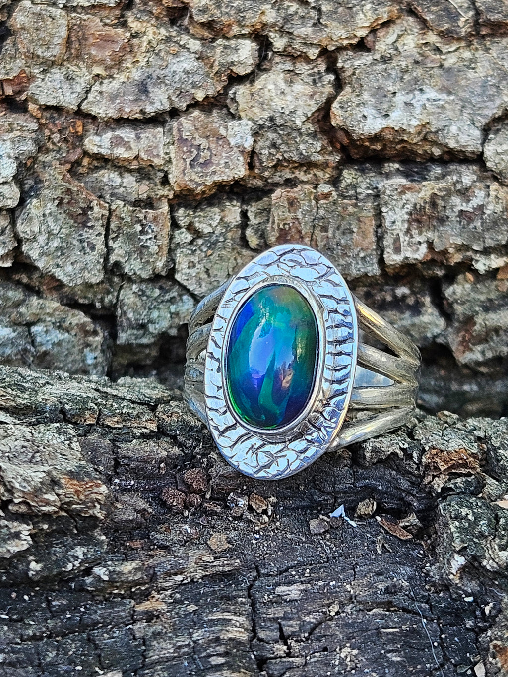  Shop our handcrafted Abyssal Fire Ring. Featuring a natural black Ethiopian opal with 3D neon green & blue fire set in a rustic