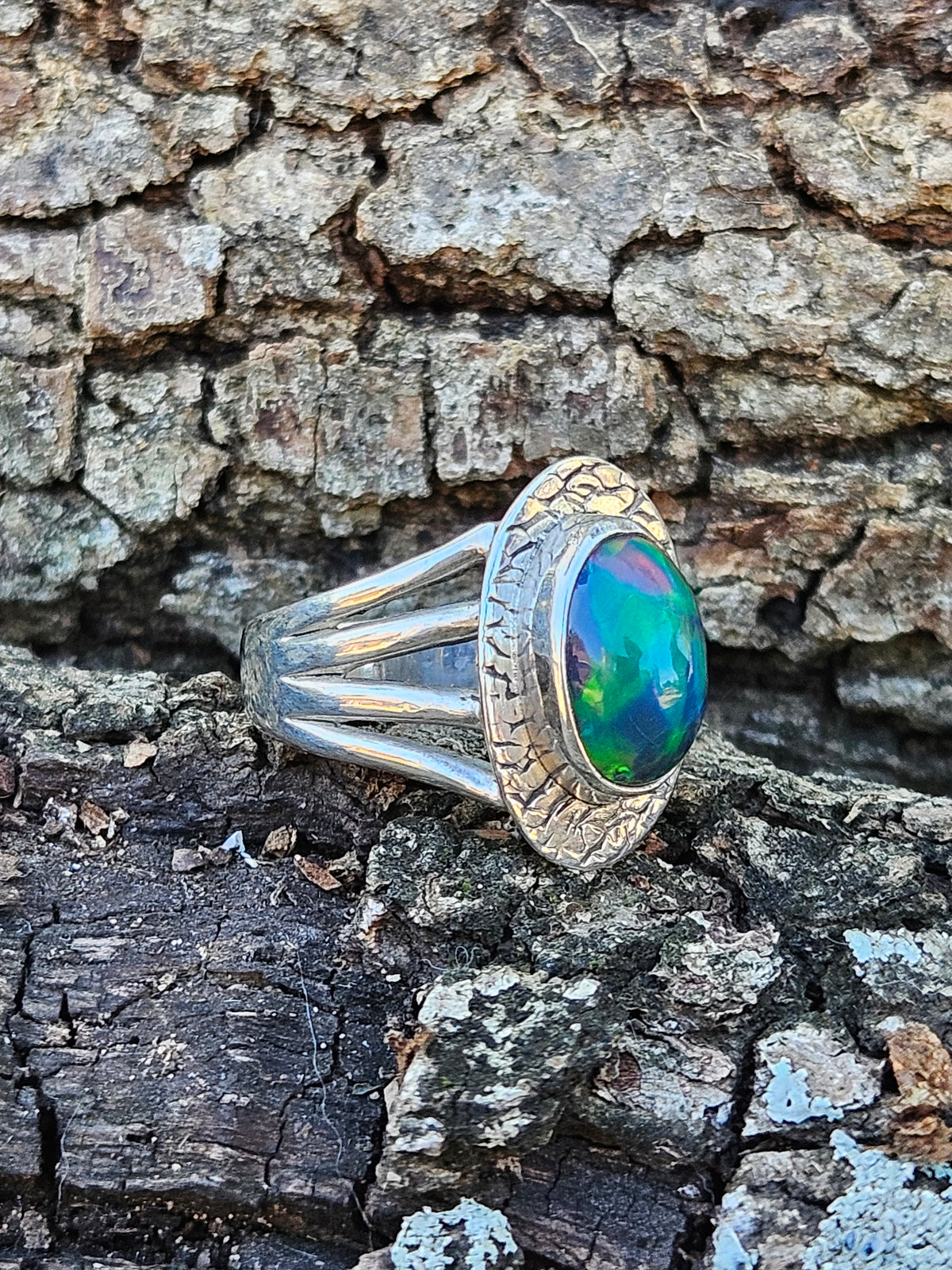  Shop our handcrafted Abyssal Fire Ring. Featuring a natural black Ethiopian opal with 3D neon green & blue fire set in a rustic