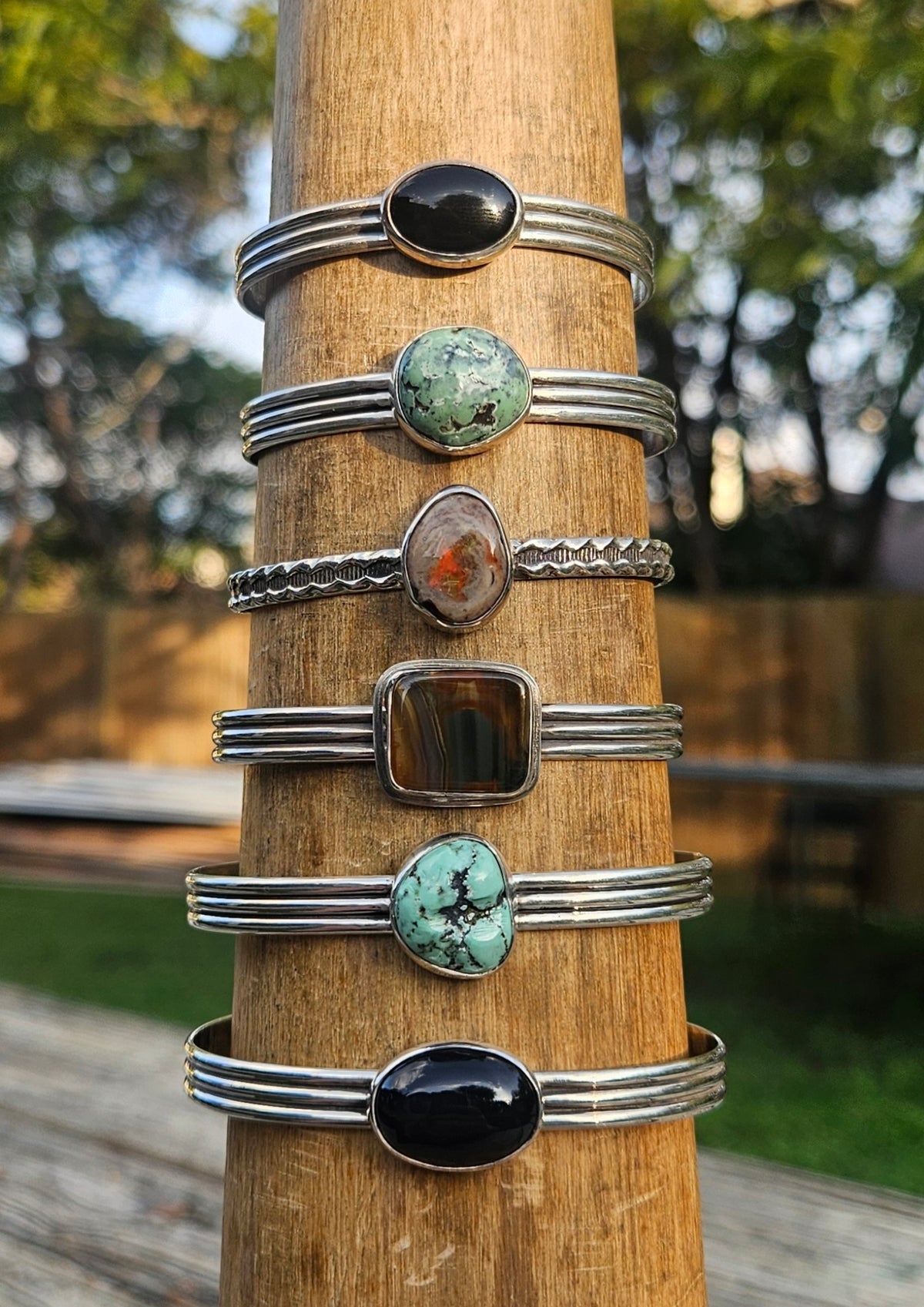Sterling silver bracelet with black onyx, turquoise, opal, and agate.