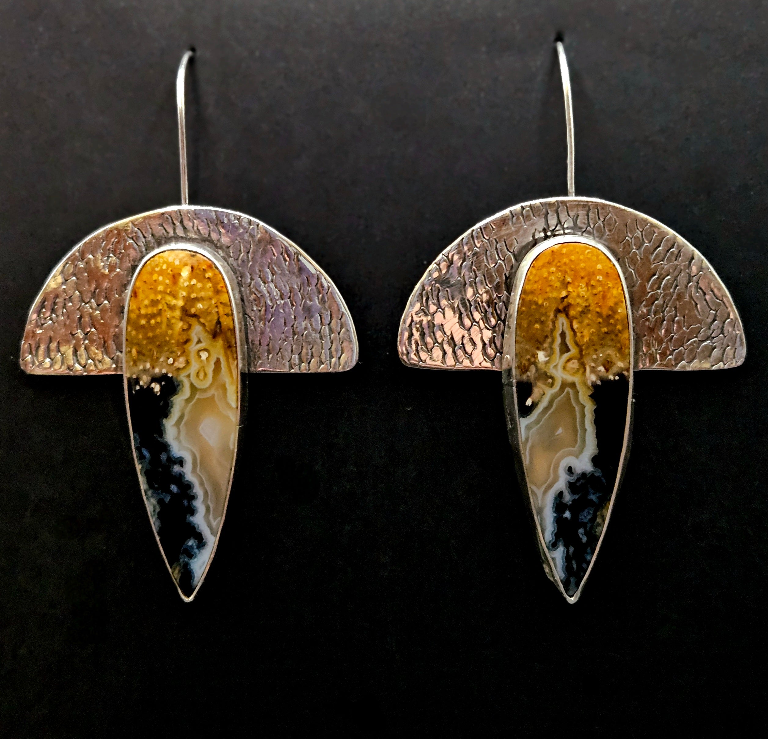 Petrified Palm Wood Earrings set in sterling silver with a textured backplate. Egyptian style and colors of black, white, and yellow.
