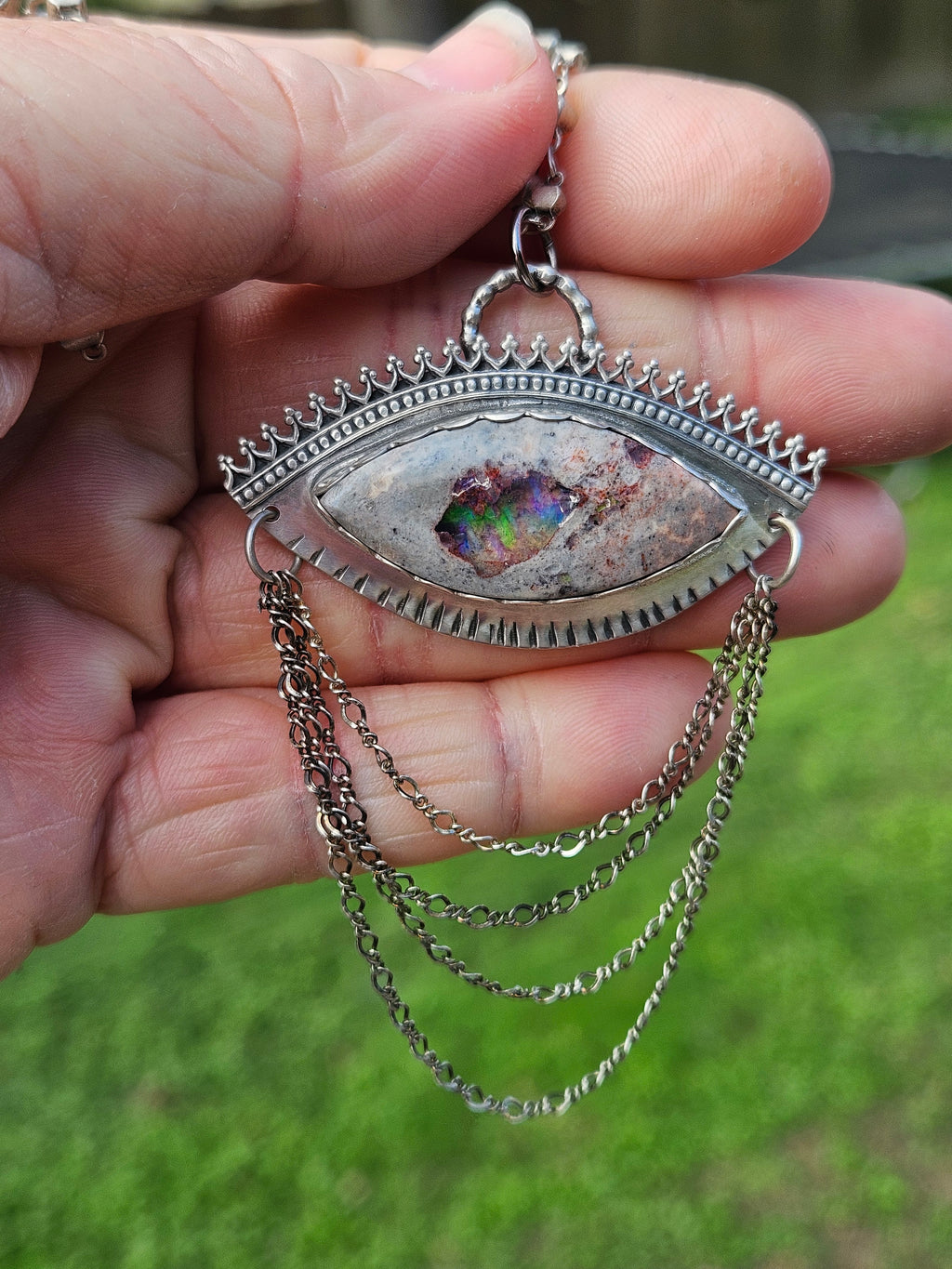 Sterling Silver Statement Pendant featuring an eye shaped Mexican Matrix Opal with casacading silver chains. 
