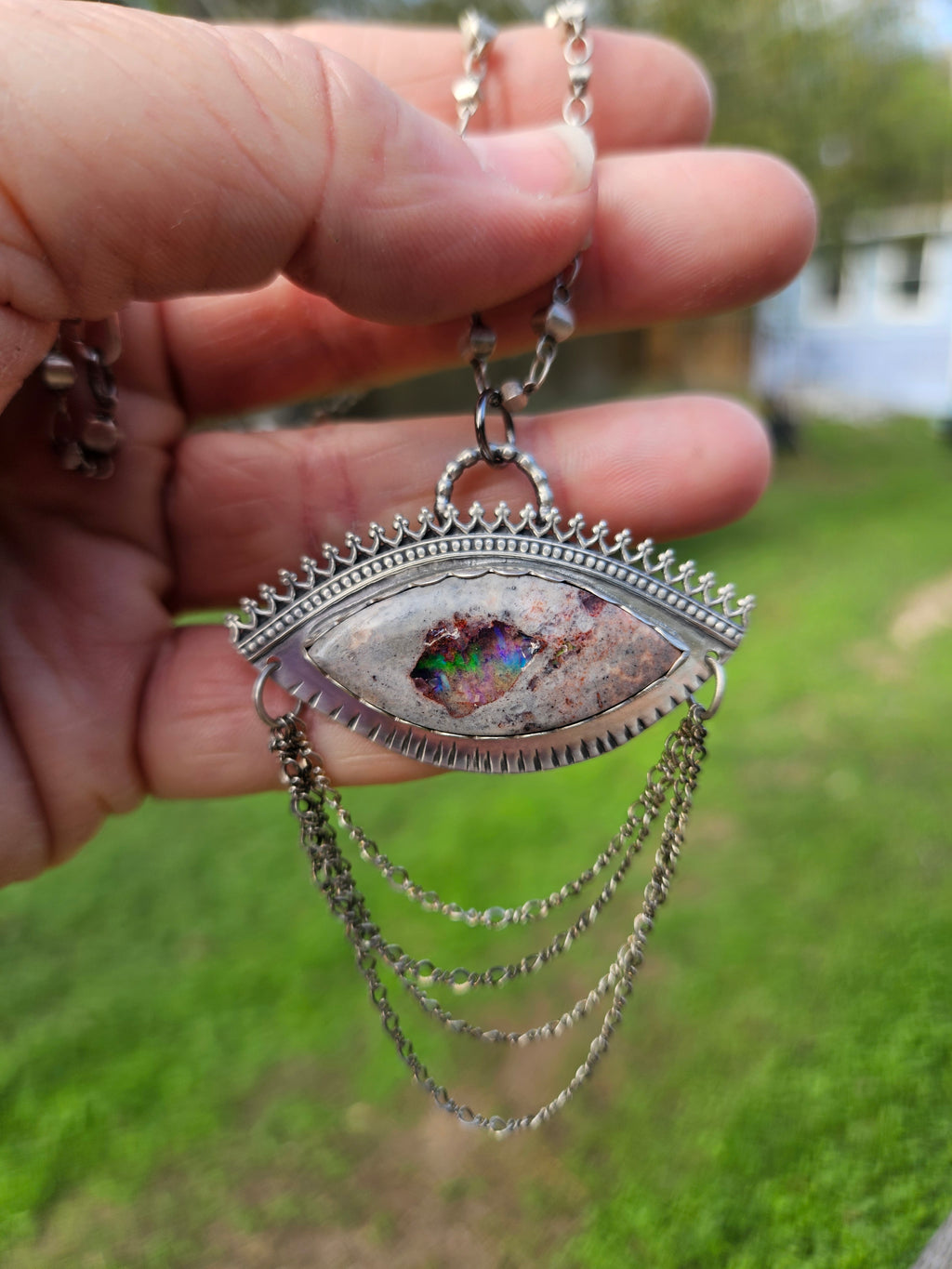 Sterling Silver Statement Pendant featuring an eye shaped Mexican Matrix Opal with casacading silver chains. 