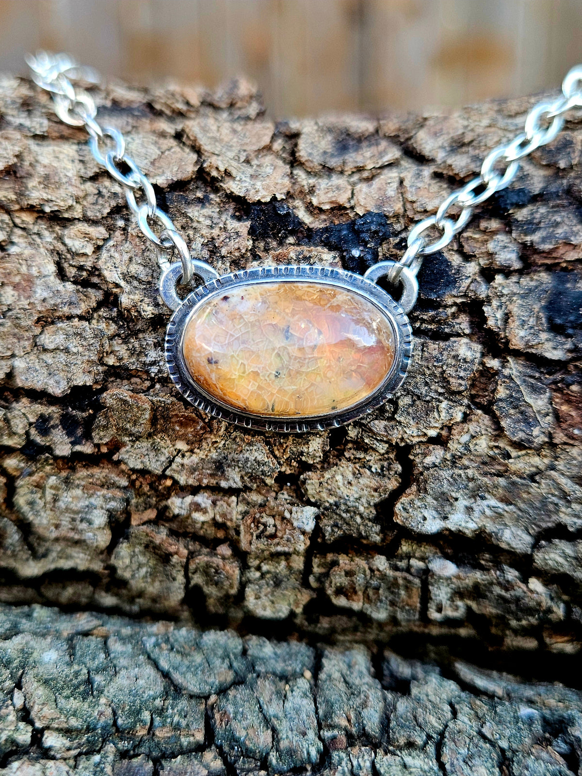 Oval shaped Mexican Fire Opal set in sterling silver 