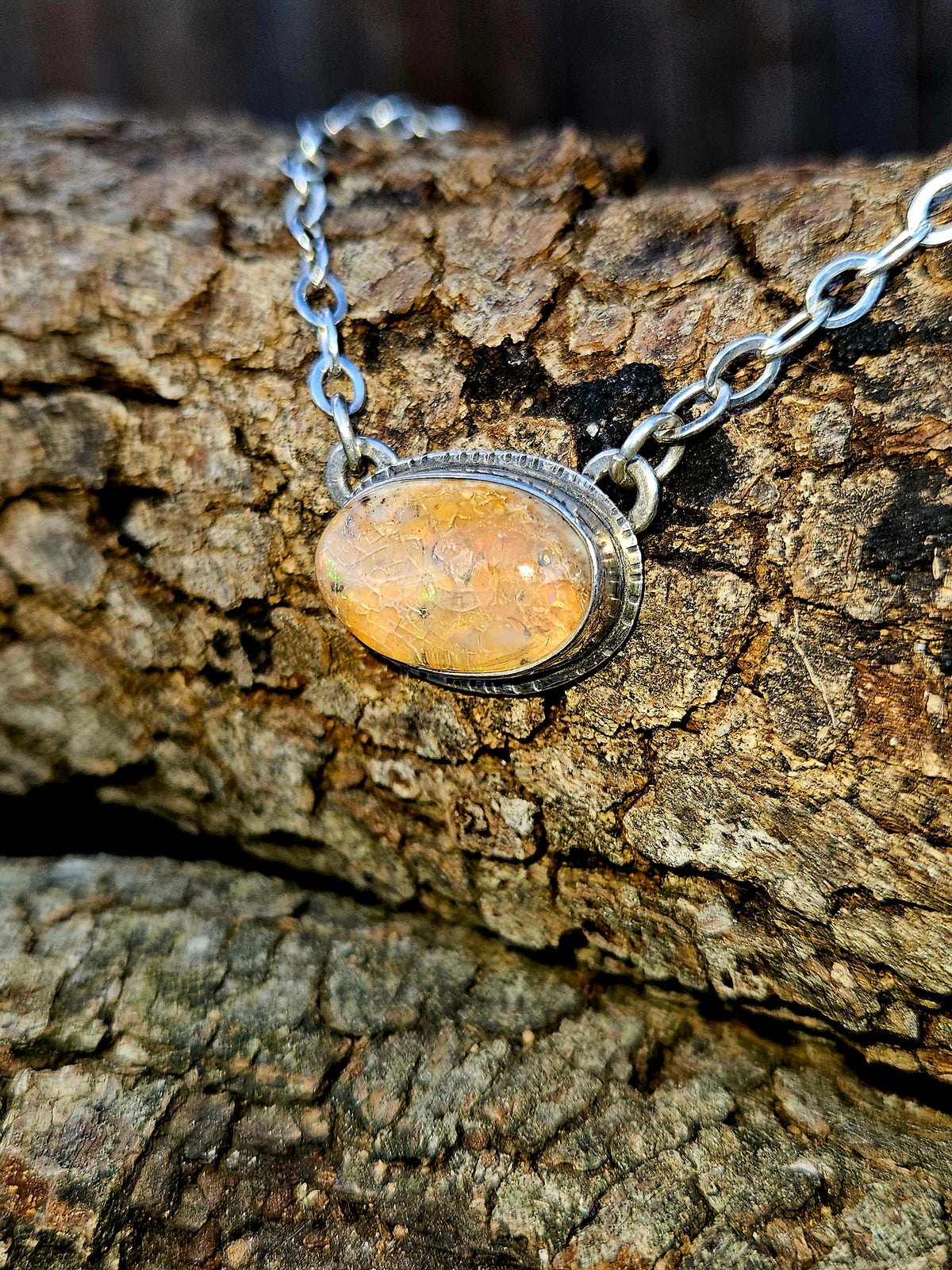 Oval shaped Mexican Fire Opal set in sterling silver 