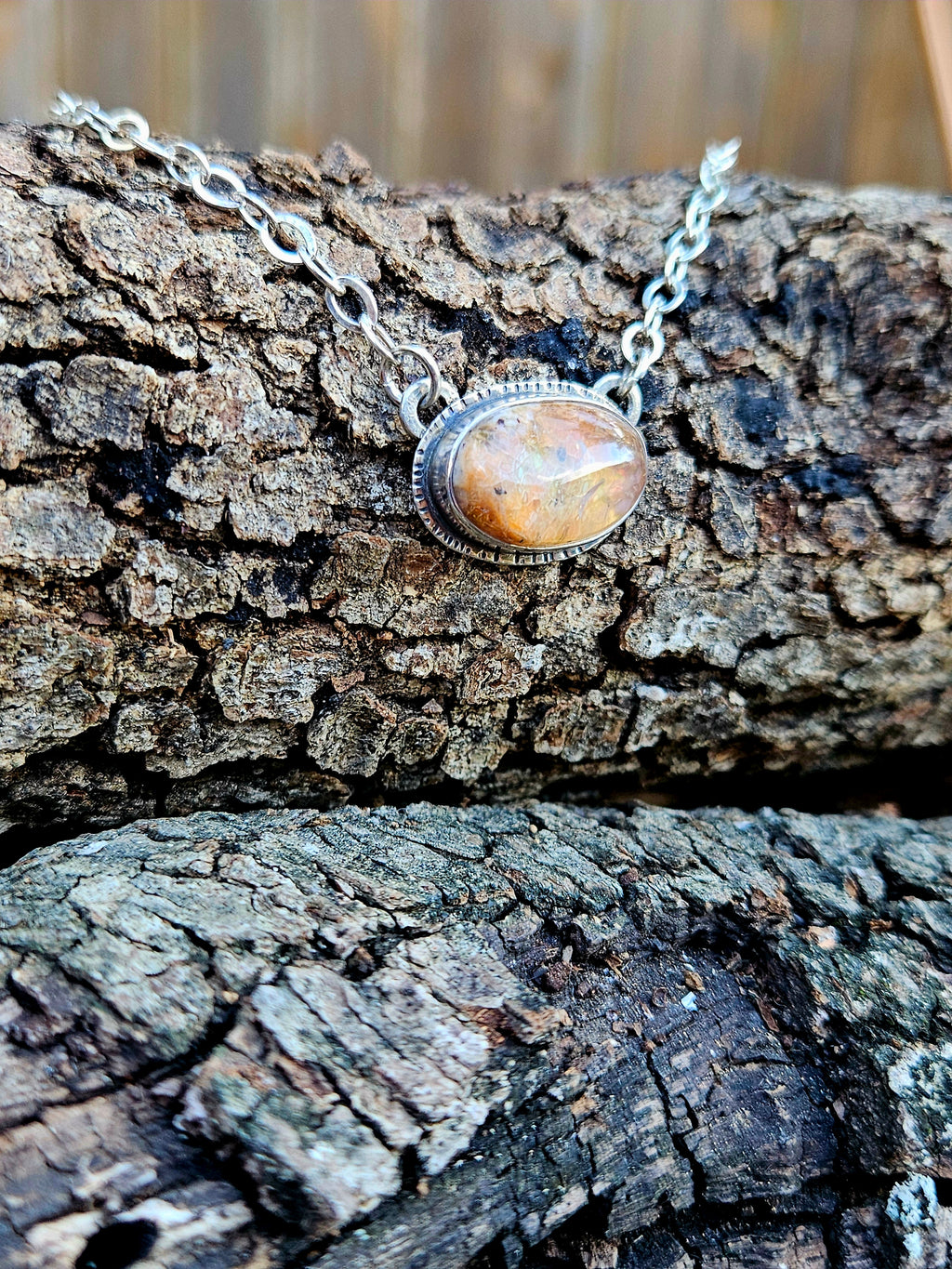 Oval shaped Mexican Fire Opal set in sterling silver 