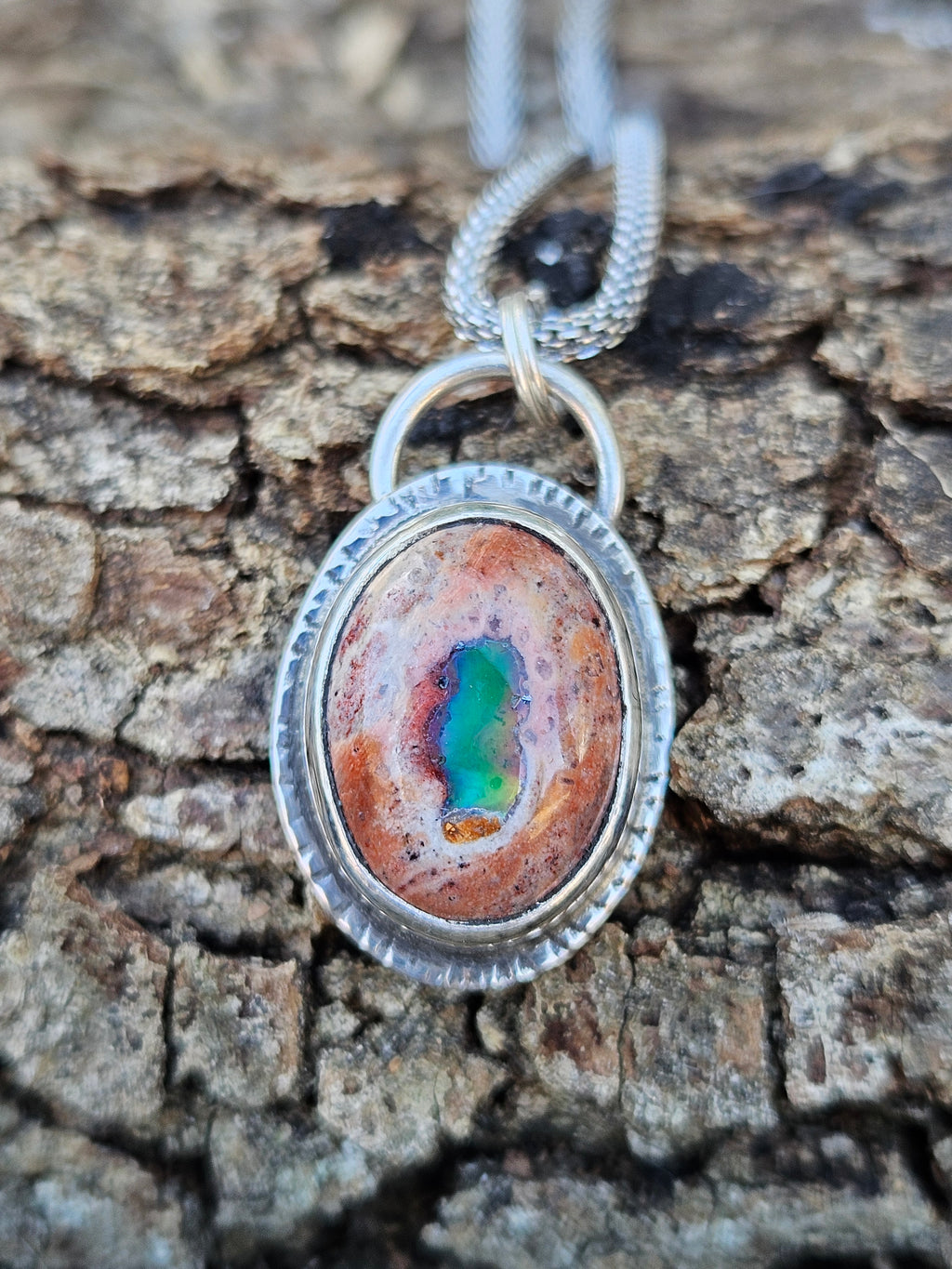 Mexican Matrix Opal Pendant set in sterling silver with lots of color 