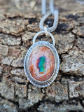 Mexican Matrix Opal Pendant set in sterling silver with lots of color 