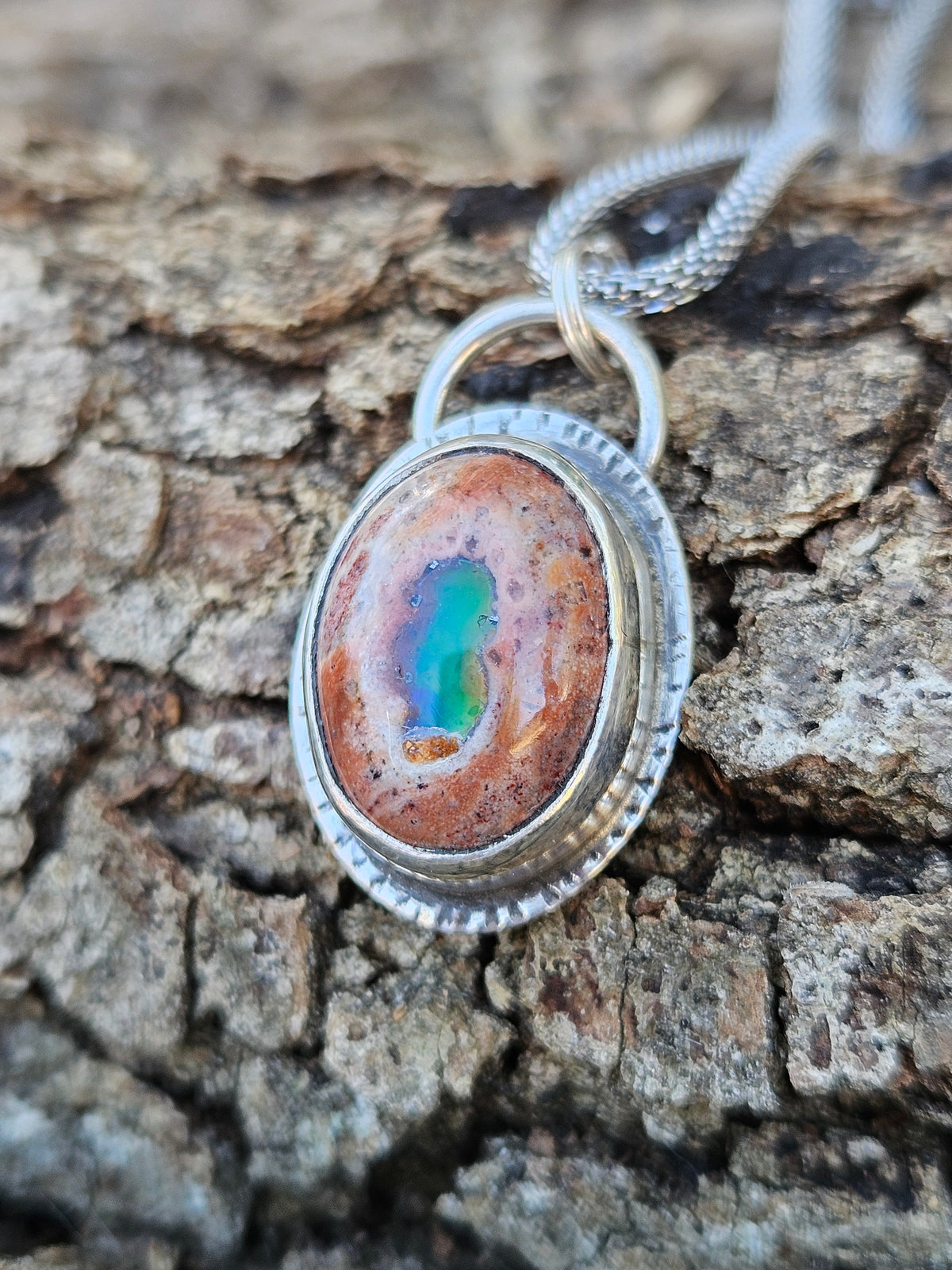 Mexican Matrix Opal Pendant set in sterling silver with lots of color