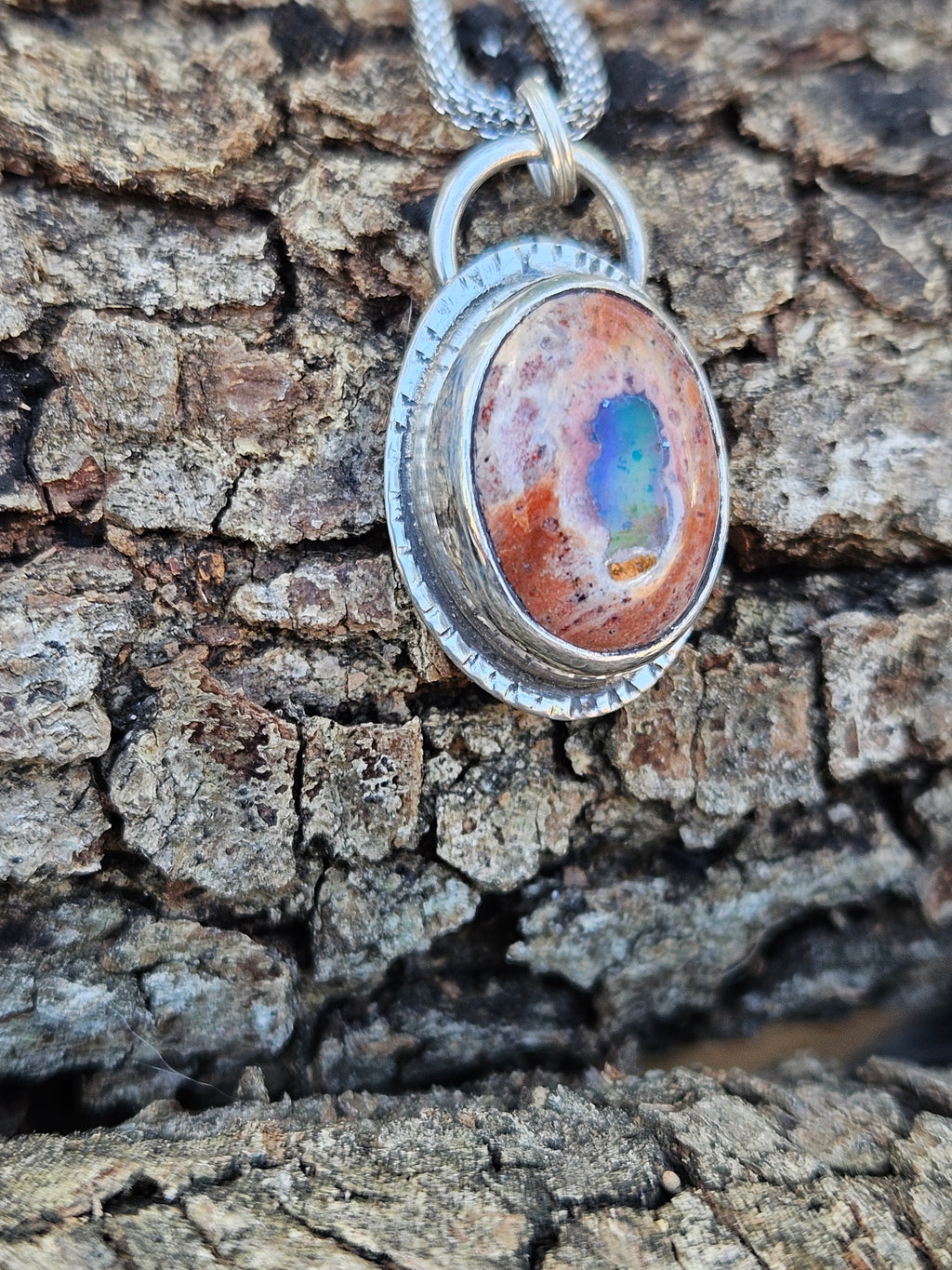 Mexican Matrix Opal Pendant set in sterling silver with lots of color