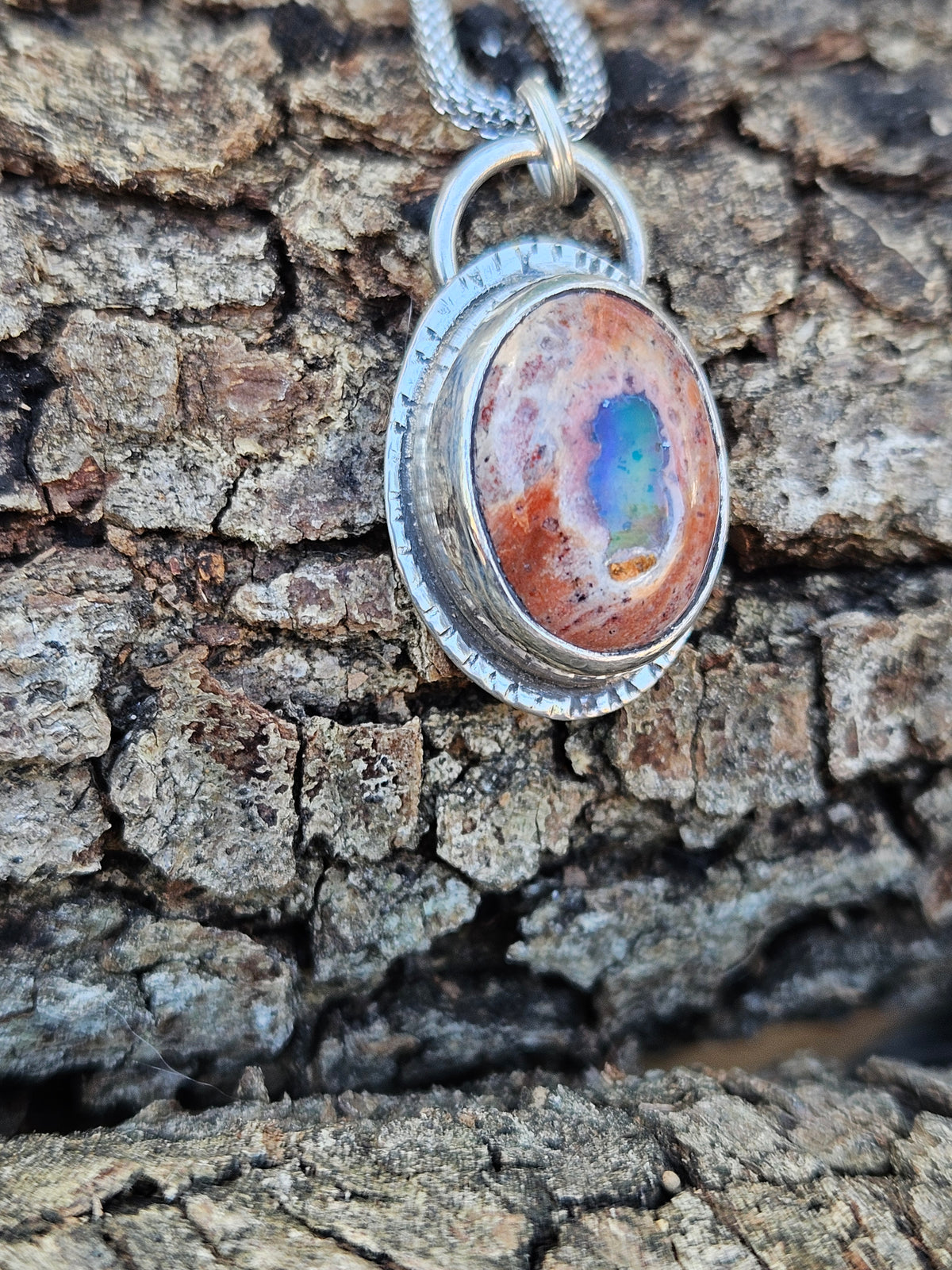 Mexican Matrix Opal Pendant set in sterling silver with lots of color