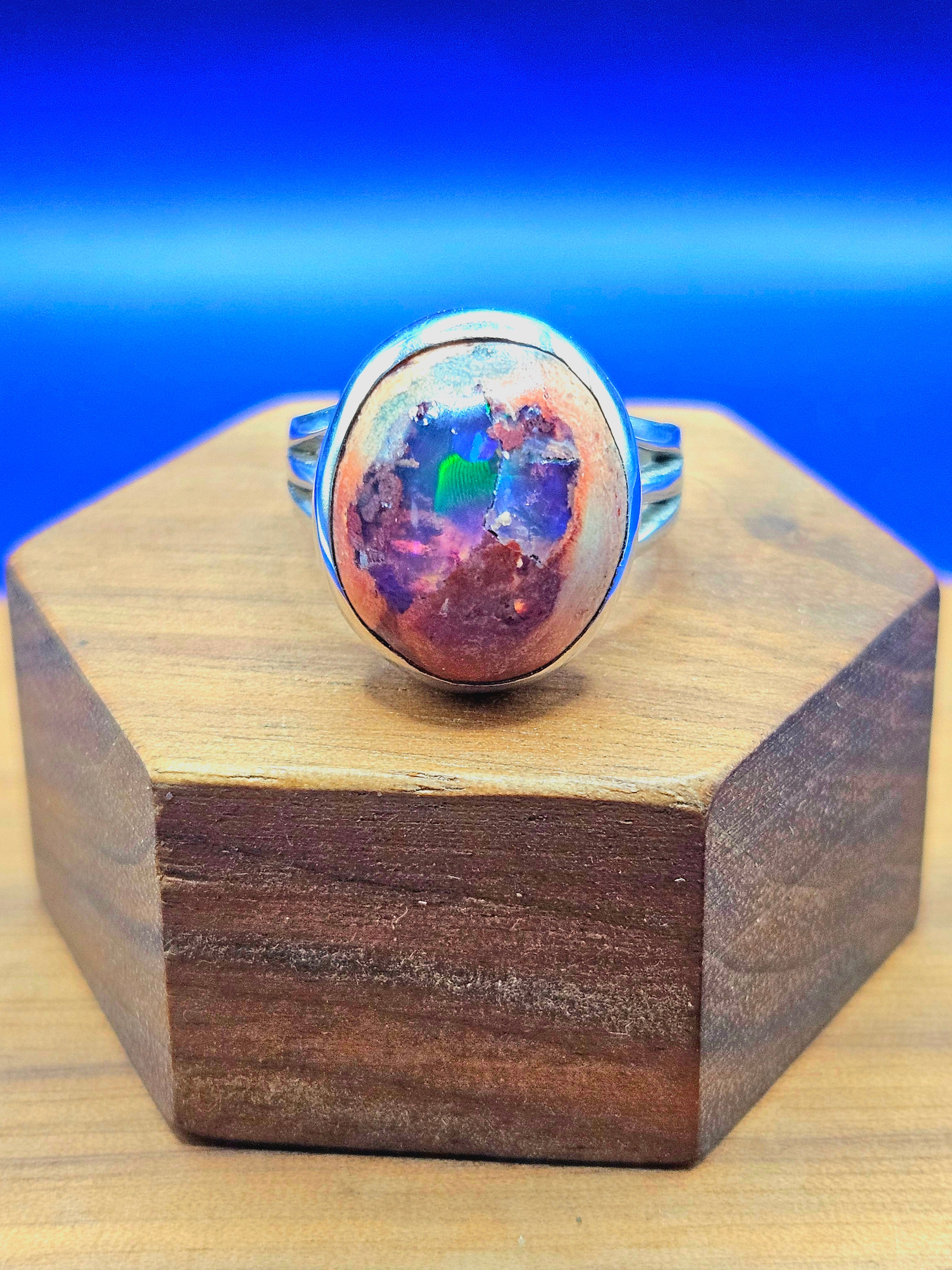 Mexican matrix opal ring set in sterling silver with purple, blue and green colors. Size 6.25