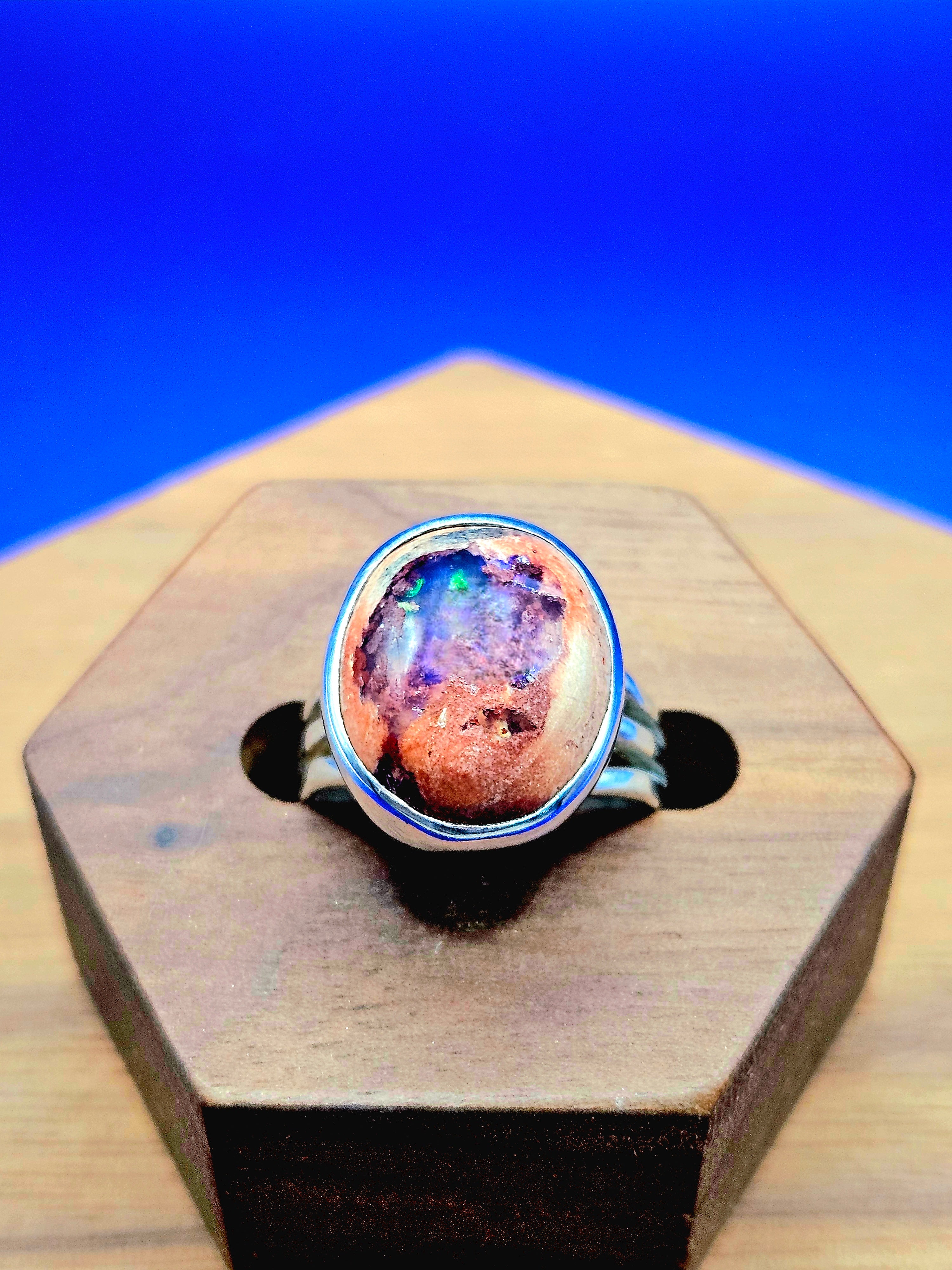 Mexican matrix opal ring set in sterling silver with purple, blue and green colors. Size 6.25