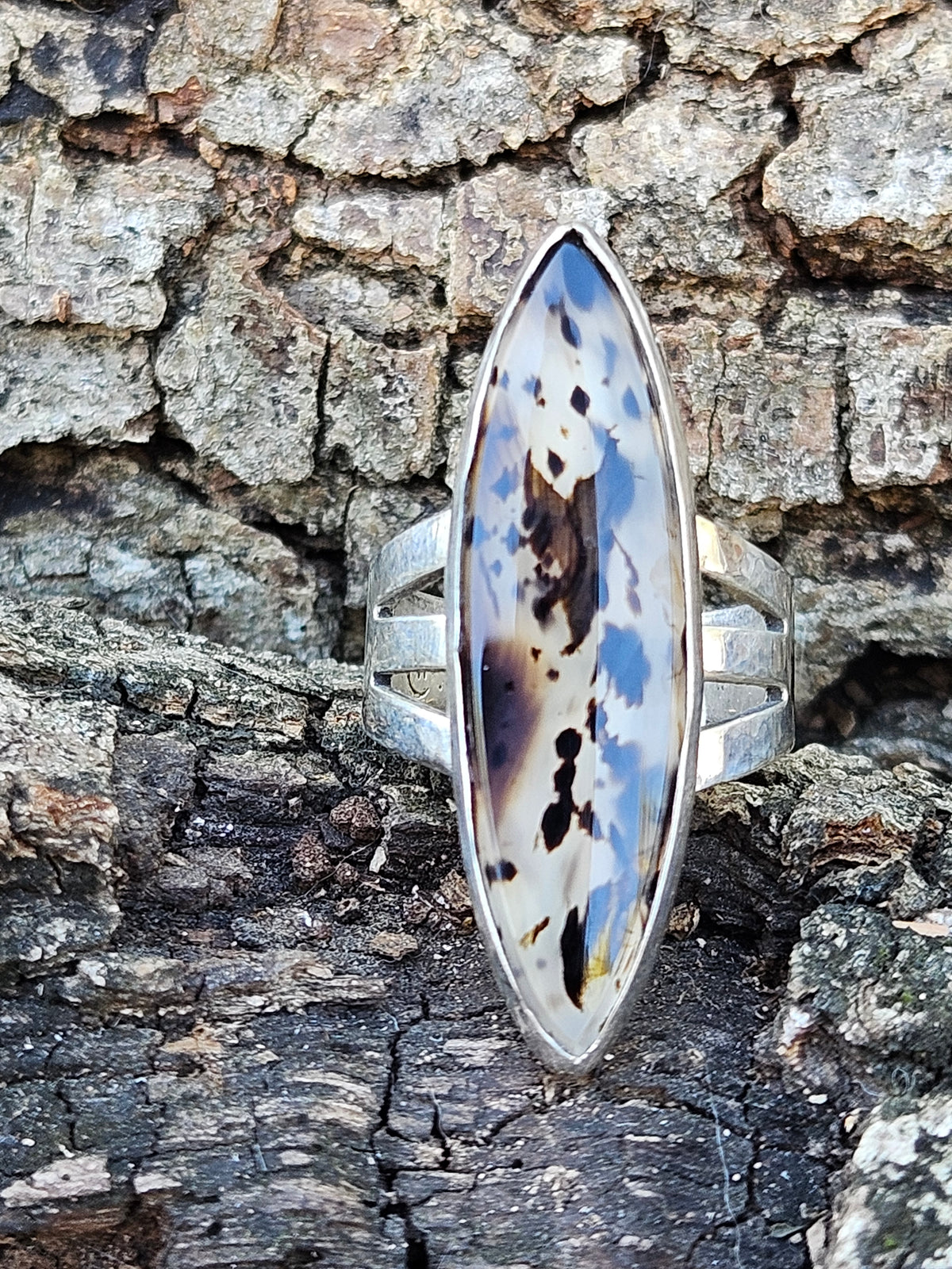 Marquise shaped Montana Moss Agate Ring set in sterling silver with a 3 band setting. Clear and black. Size 6.5