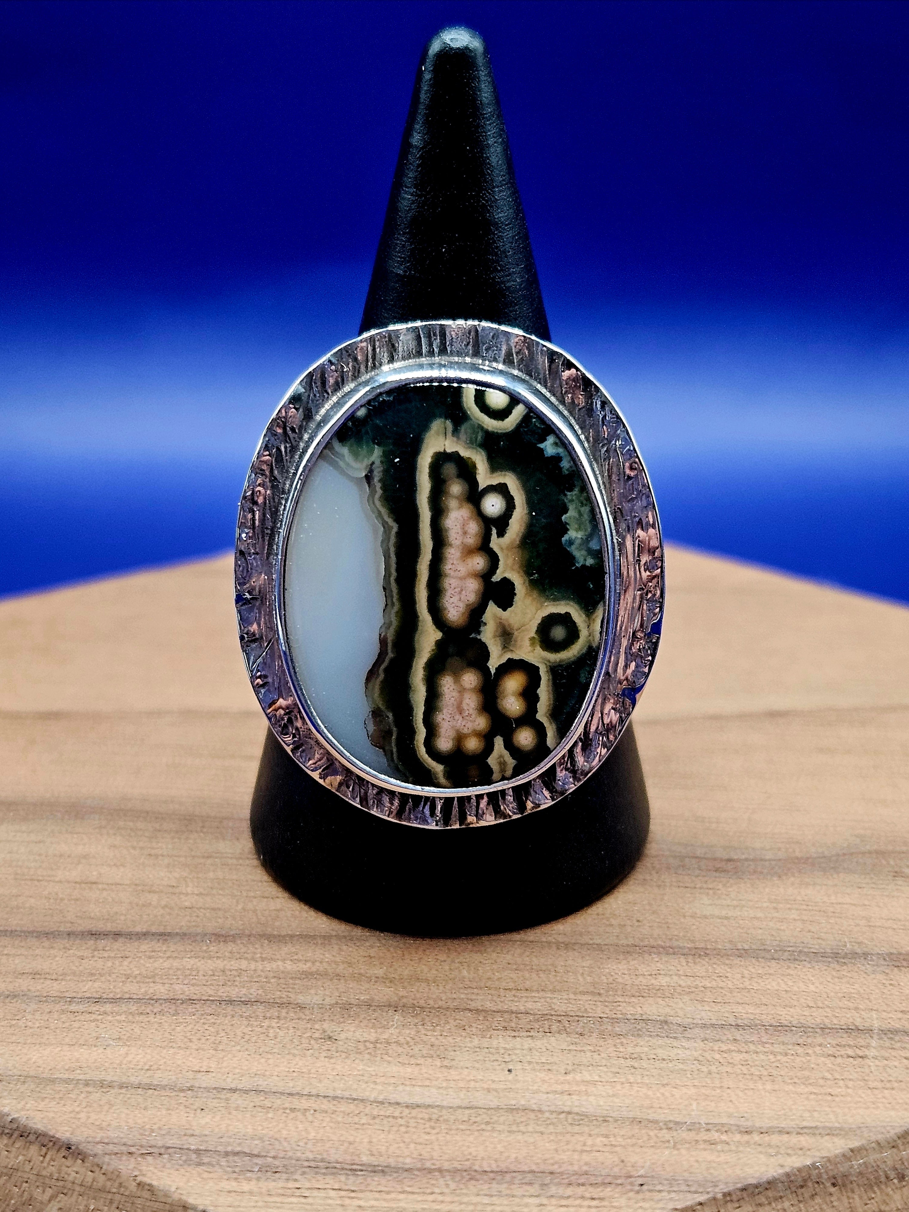 Ocean Jasper Ring Size 8 set in sterling silver with a textured border. Mutli colors- white, green, cream, yellow, and black.