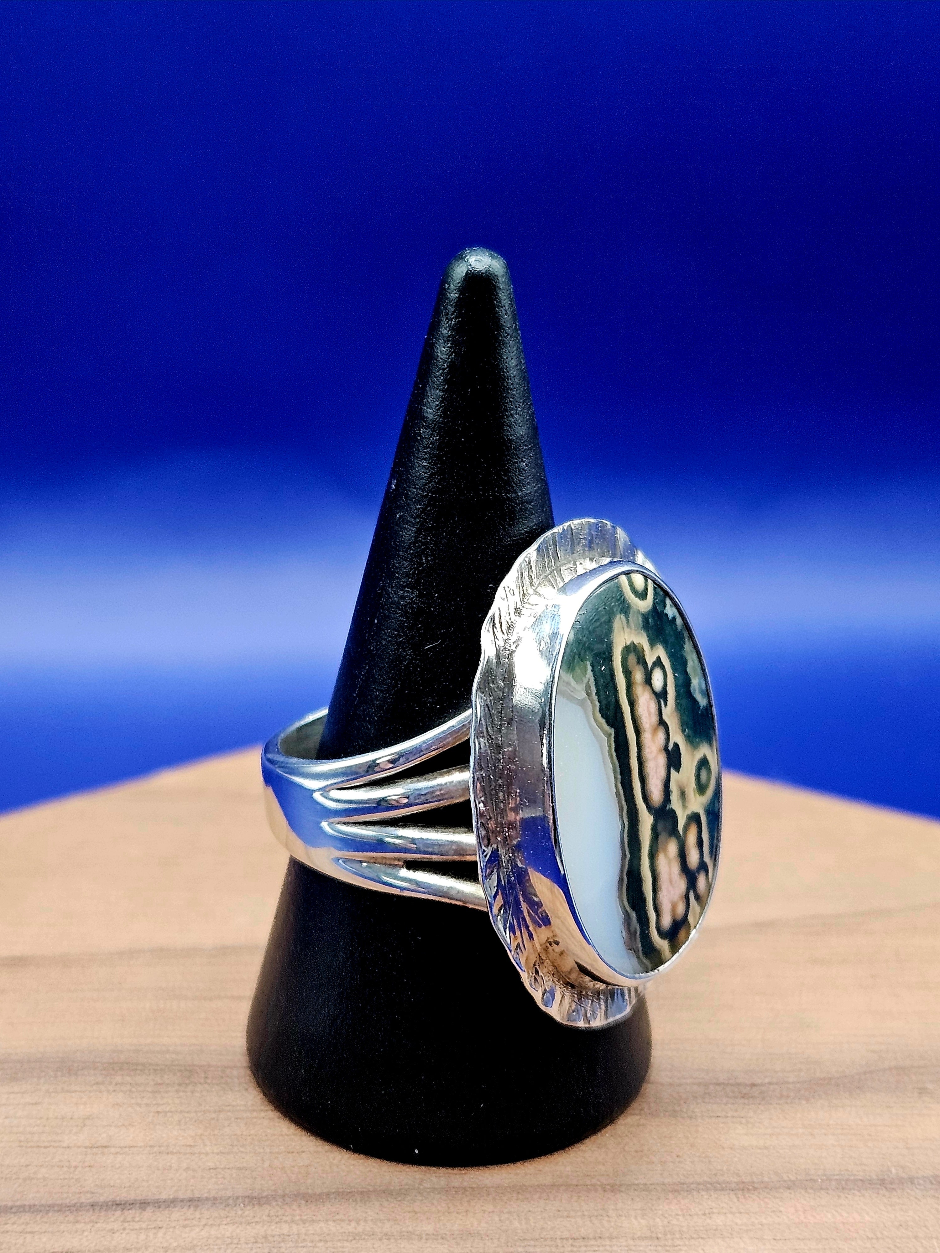 Ocean Jasper Ring Size 8 set in sterling silver with a textured border. Mutli colors- white, green, cream, yellow, and black.