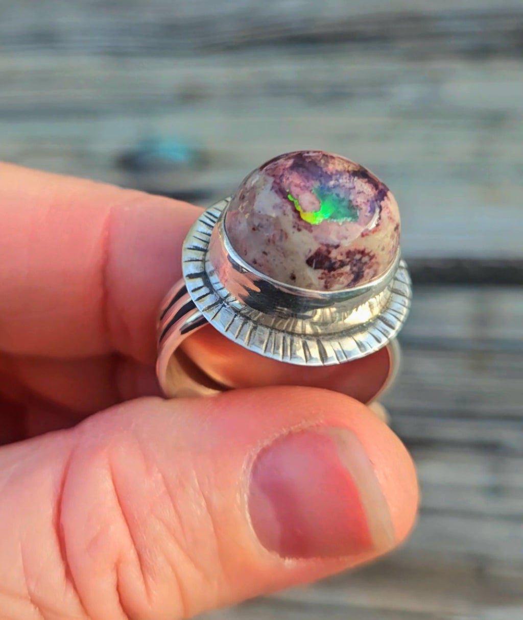 Tall Mexican Matrix Opal set in sterling silver with a textured back plate on our Rising Sun band. Size 10
