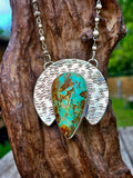 Royston Turquoise Teardrop Pendant set in sterling silver with a crescent backplate with a textured hand stamped finish.