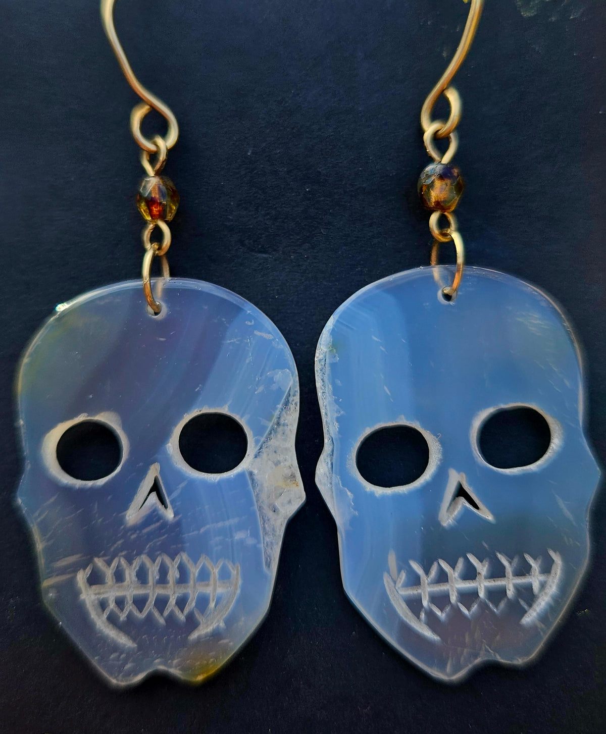 Rainbow Iris Agate Skull Earrings with 12k gold filled French wire hooks.

