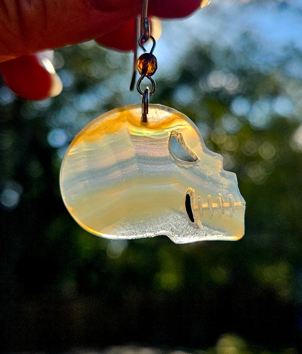Rainbow Iris Agate Skull Earrings with Sterling Silver French wire hooks.