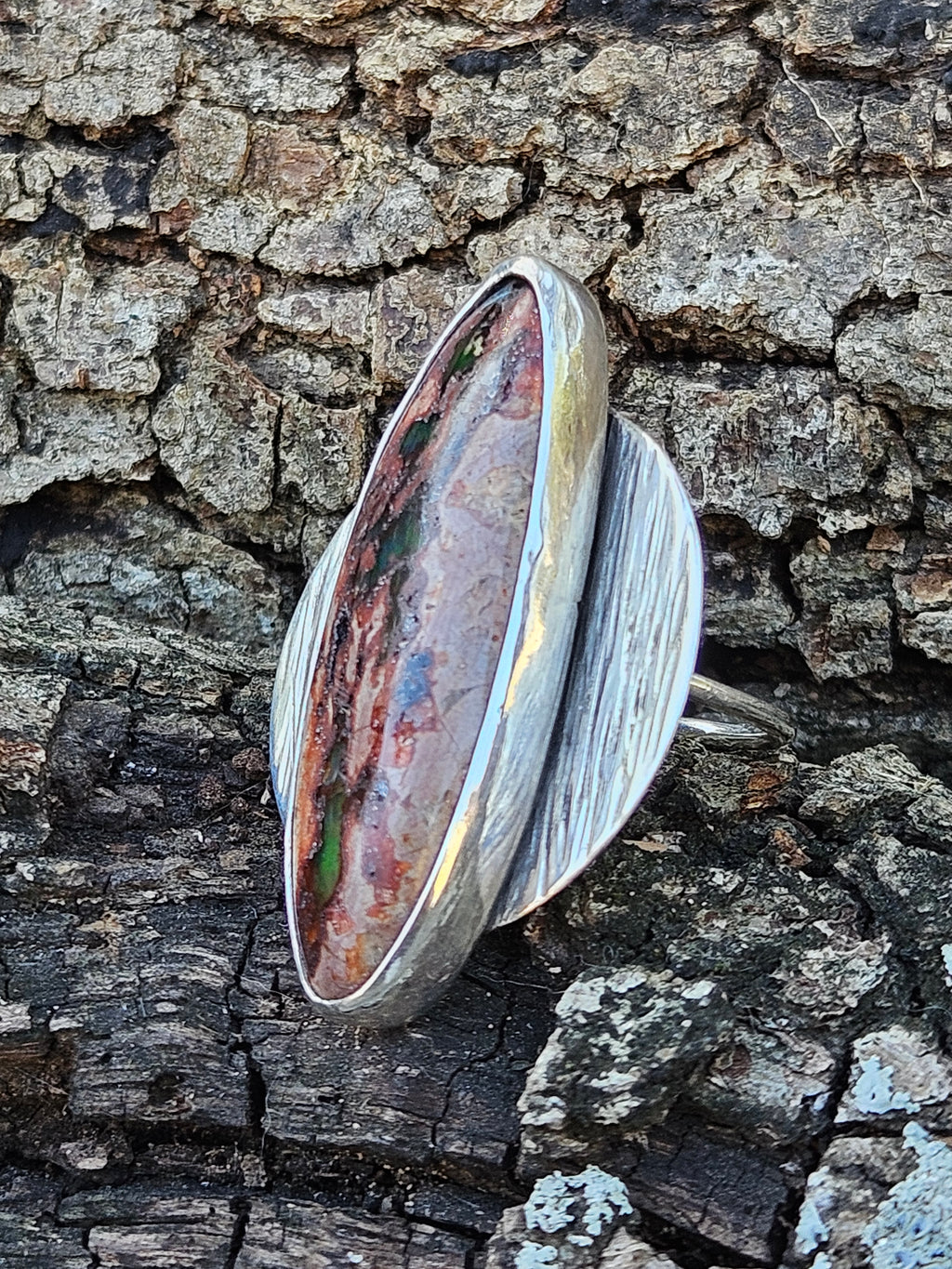 Large sterling silver disc ring with an oval shaped Mexican Matrix Opal set it the middle. 