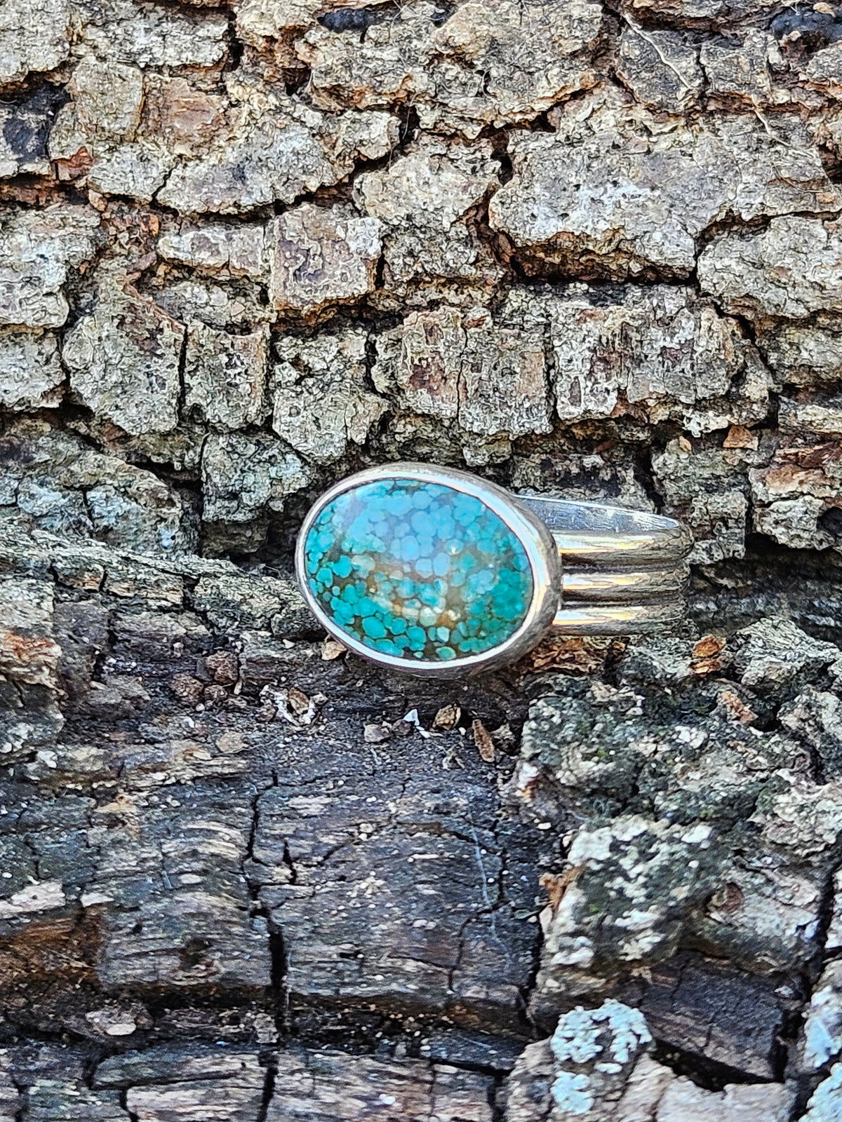 Oval shaped Hubei Spideweb Turquoise Ring set in sterling silver. Size 12