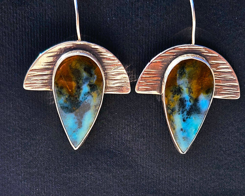 Geometric half moon textured silver earrings with teardrop blue opalized wood. Dangle- blue, brown, and black colors.