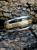 Triple Band Cuff with a wide 12k gold filled floral pattern wire band and 2 silver bands.