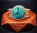 Round Hubei Spiderweb Turquoise Bracelet set in sterling silver with a textured border and 2 bands 